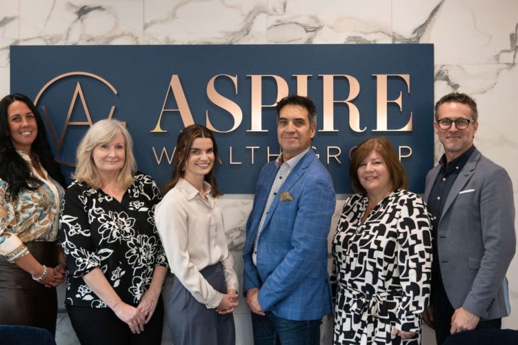 a group of people standing in front of a sign